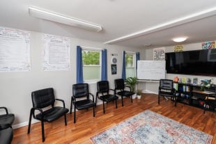 Group room with chairs arranged for a session